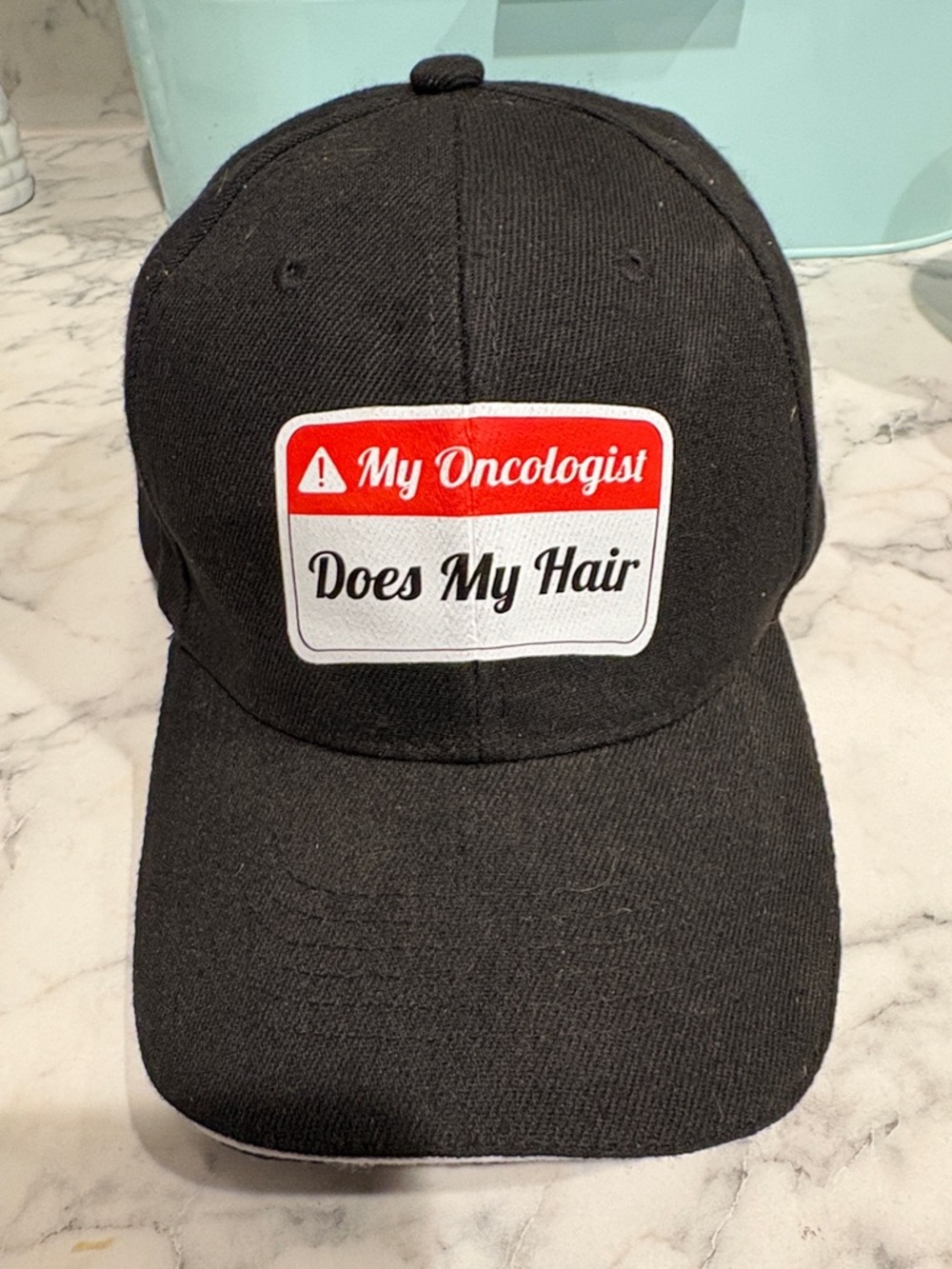 Spencer's Black Hat with Red and White Patch - "My Oncologist Does My Hair"